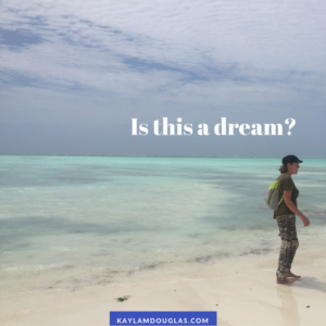 Person with narcolepsy on idyllic beach with text "Is this a dream?"