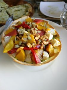 Salad with tomatoes, pumpkin, nuts etc.