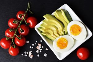 tomatoes, sliced avocado, boiled egg, pink salt