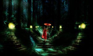Monk in a dark forest on dimly lit path