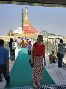 woman in front of a pagoda 