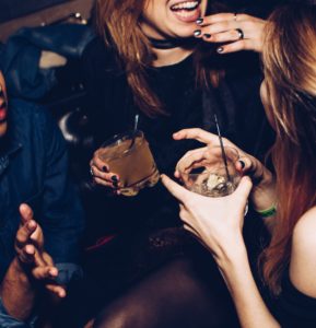 women building relationships with narcolepsy talking at a party 