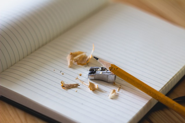 empty notebook with a pencil sharpened for writing 