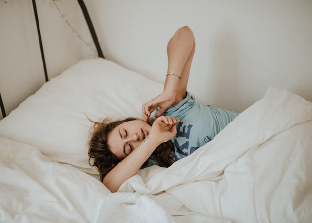 woman waking up happy